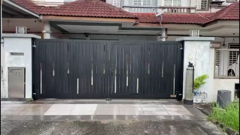 A black fully aluminium SmartGate folding gate, closed, in front of a terrace house